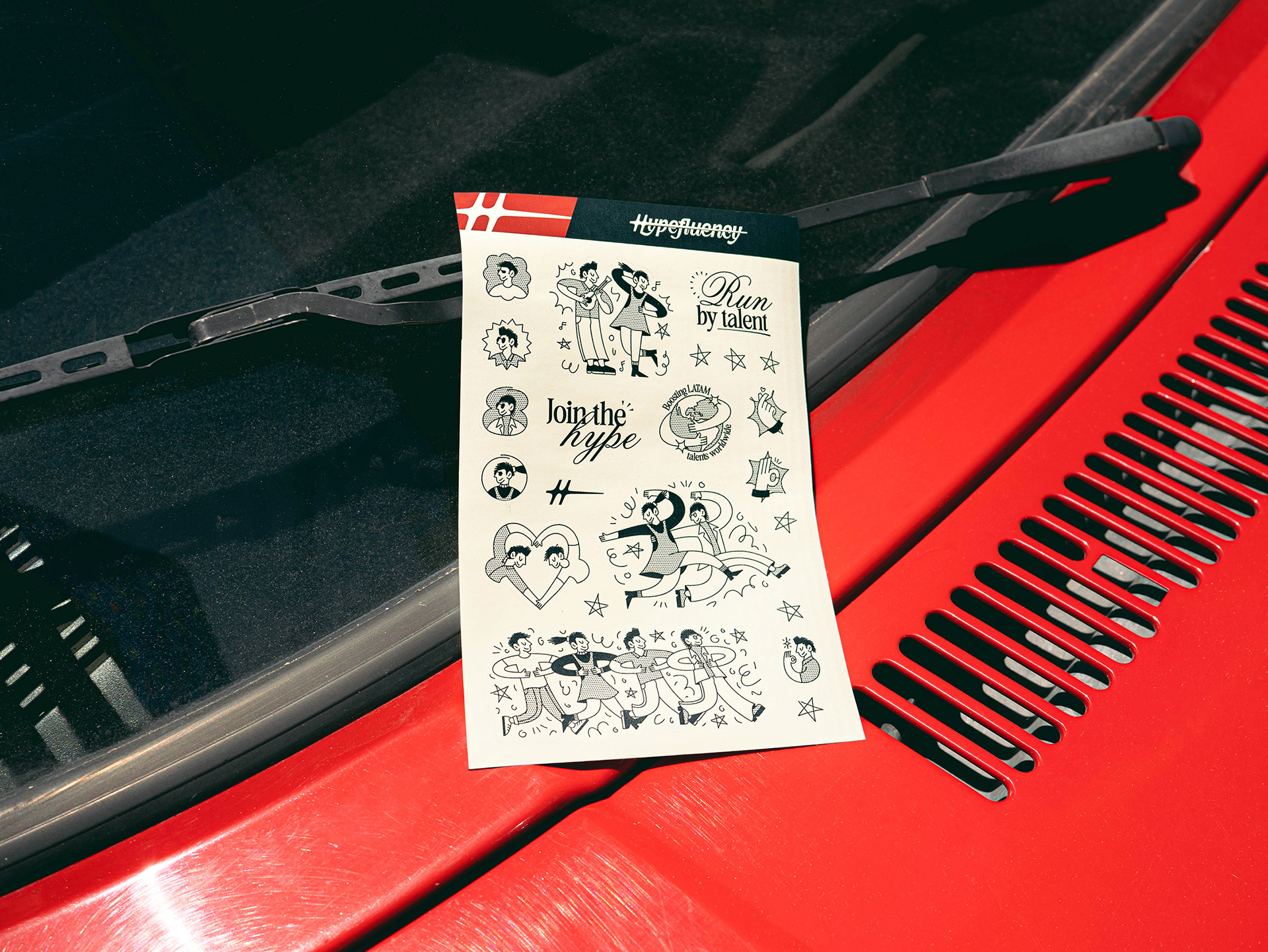 Hypefluency's sticker set over a red car